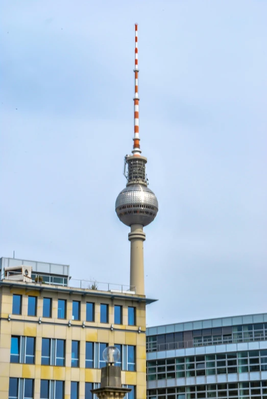 a tall metal tower sitting next to a building