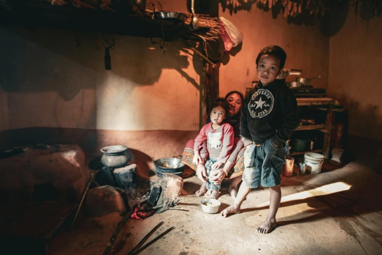 a couple of children that are sitting in the corner