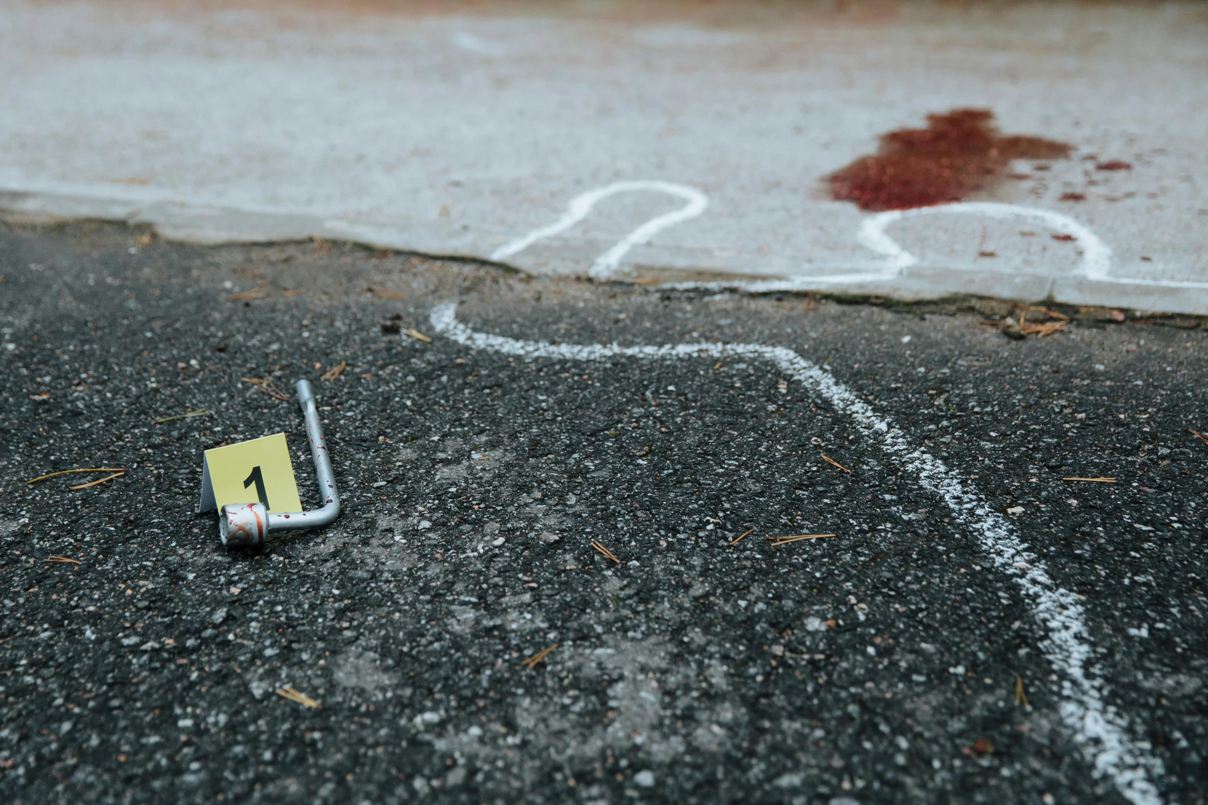 a pole lies on the ground with a sign