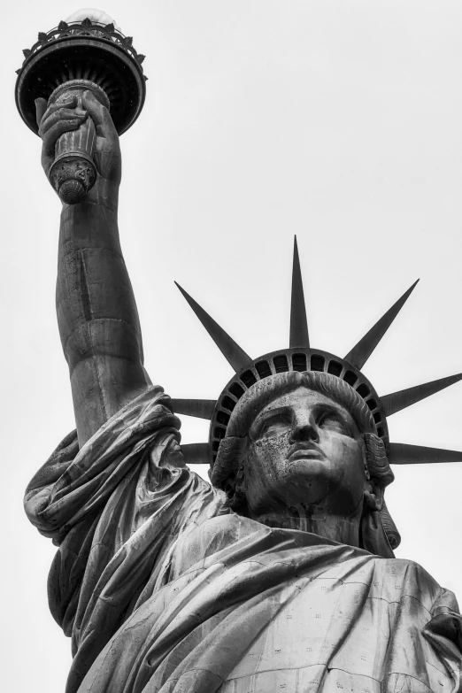 a statue of liberty with arms in the air