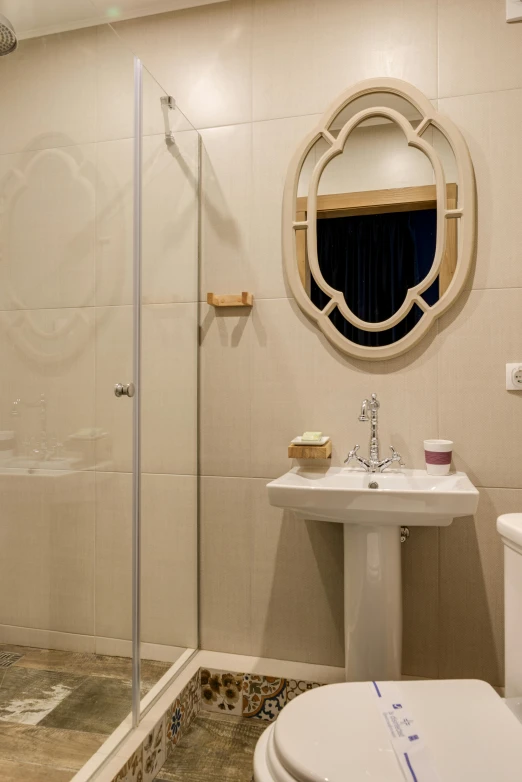 this is a shower room with a sink and a toilet