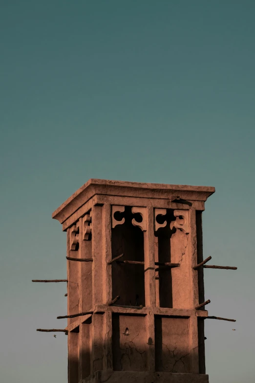 a tall building with some fencing on top