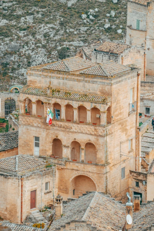 there is a view of some old buildings, with trees in the back