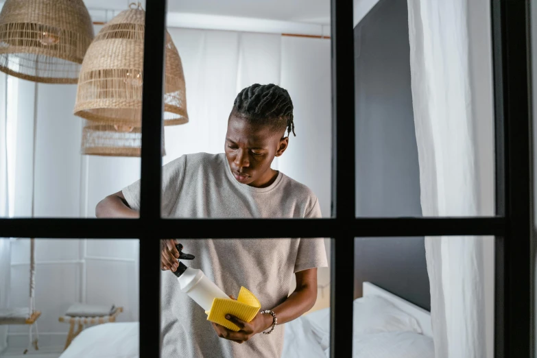 man cleaning the floor outside of his bedroom