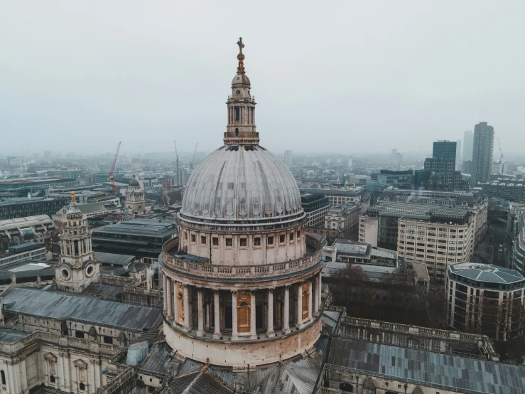 a wide view of some large buildings and a cloudy sky