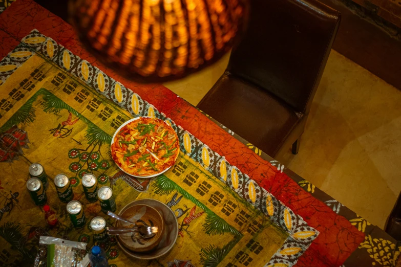 a small table with a tealight lit candle and a plate of food