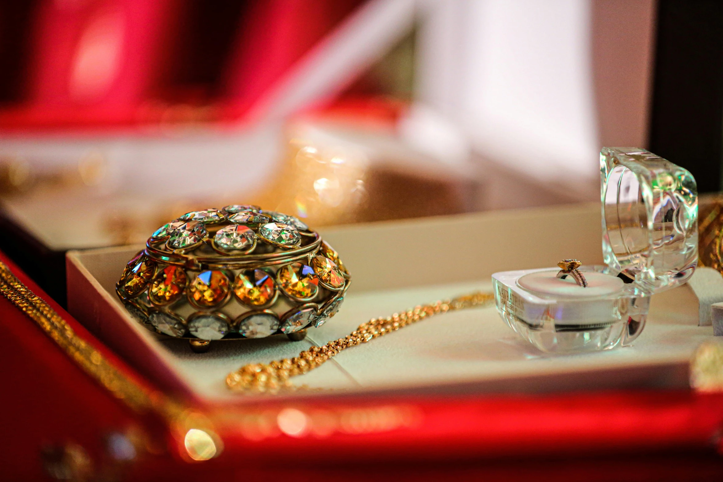 small jeweled jewelry on display in a box