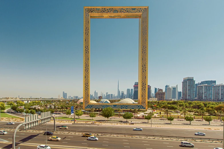 a very large frame with a view of some tall buildings