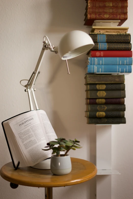 a lamp and some books are on a table