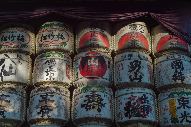 several japanese type containers stacked next to each other