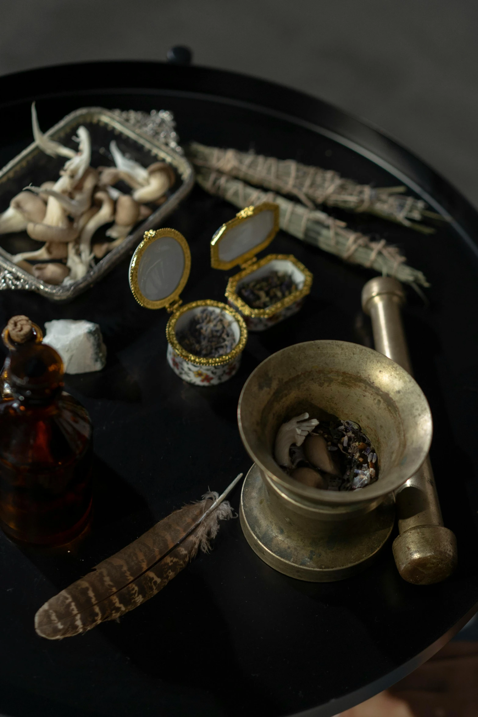 various objects on display on black table in room