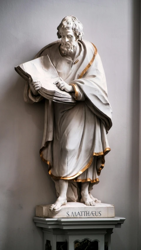 an elaborate statue that includes white robes and beard