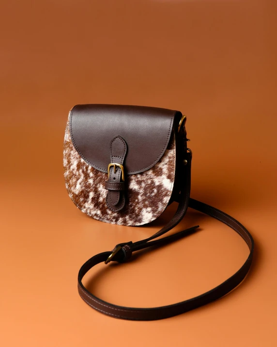 a women's purse is on a brown surface