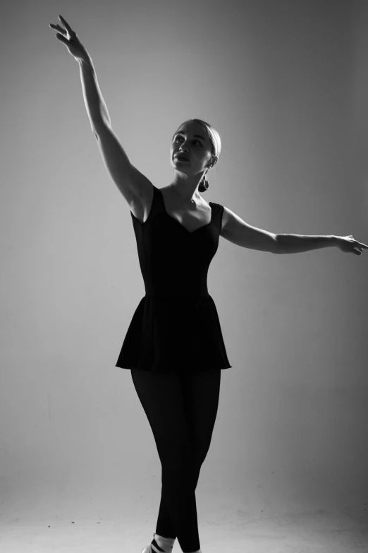 black and white po of a woman in a black outfit