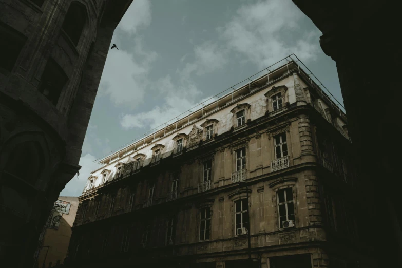 the side of a building in europe and the sky