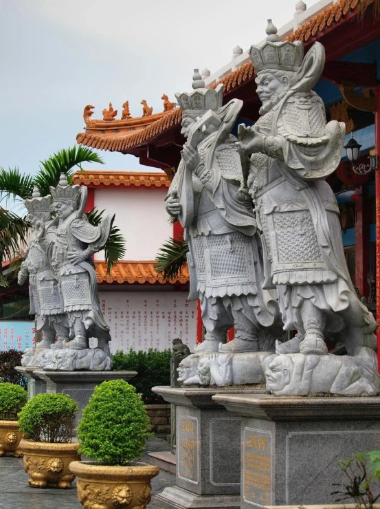 statues in front of a building with ornate decorations