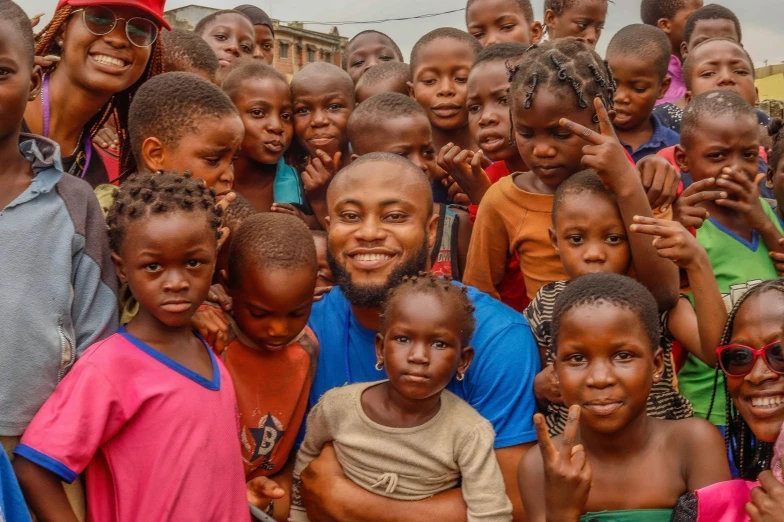 a group of young children standing next to each other