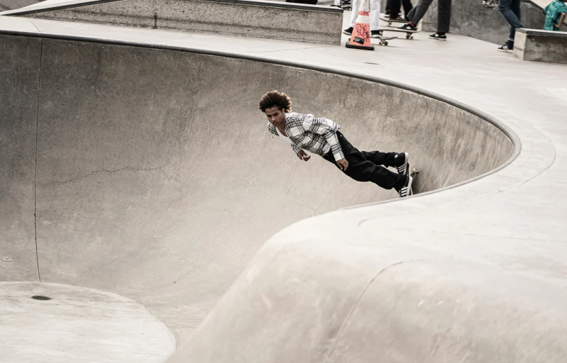 a skateboarder is skating at the skatepark