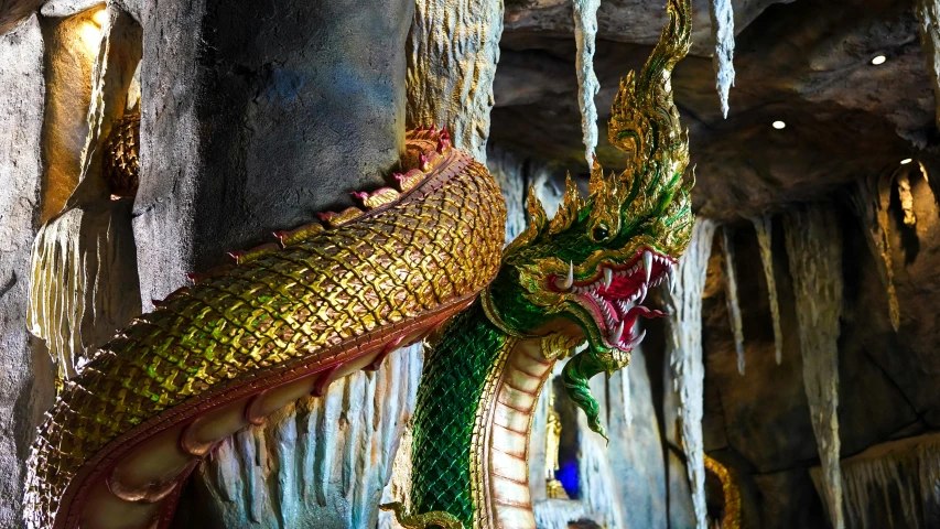 a statue of a dragon at the end of an walkway