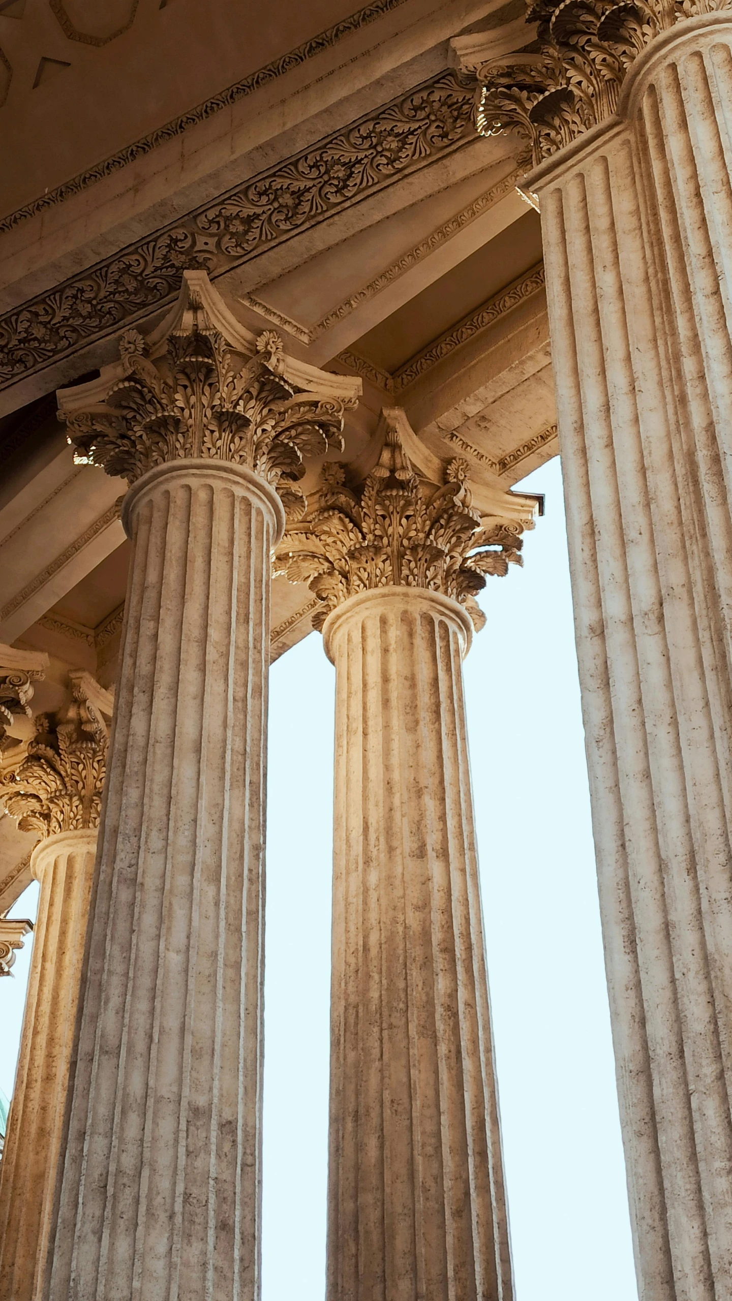 several pillars with decorative work are seen in this image