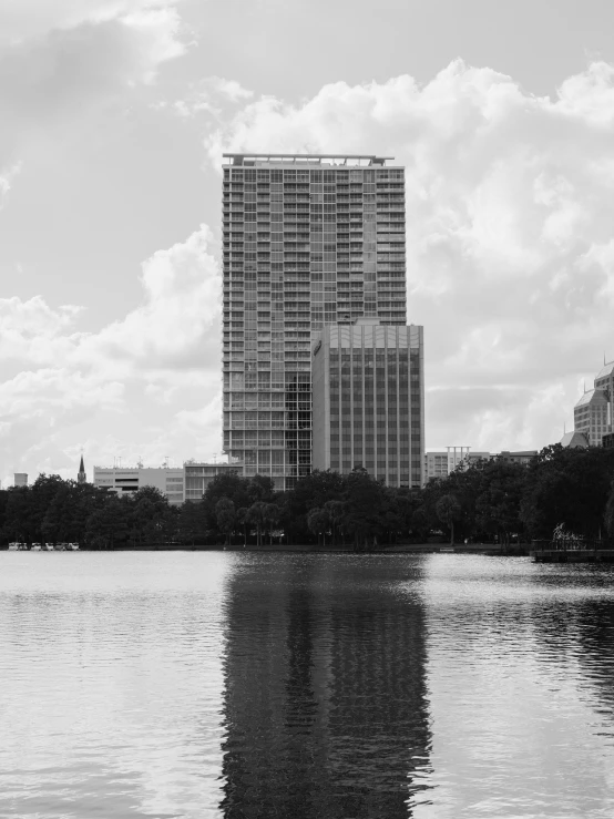 a large building with lots of windows over a body of water