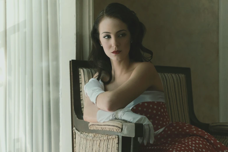 a woman with her arm wrapped in a polka dot towel