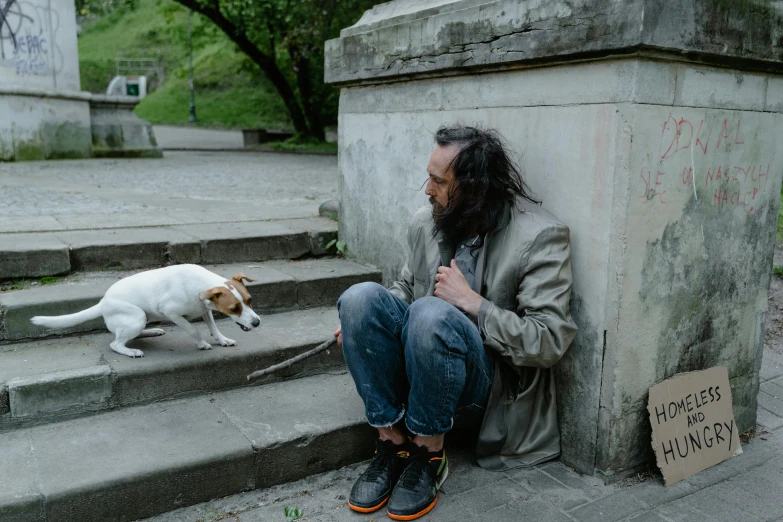 a man and his dog waiting outside for soing