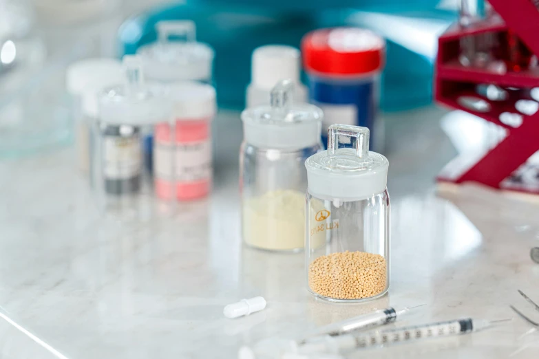 medical containers with medical instruments scattered over them