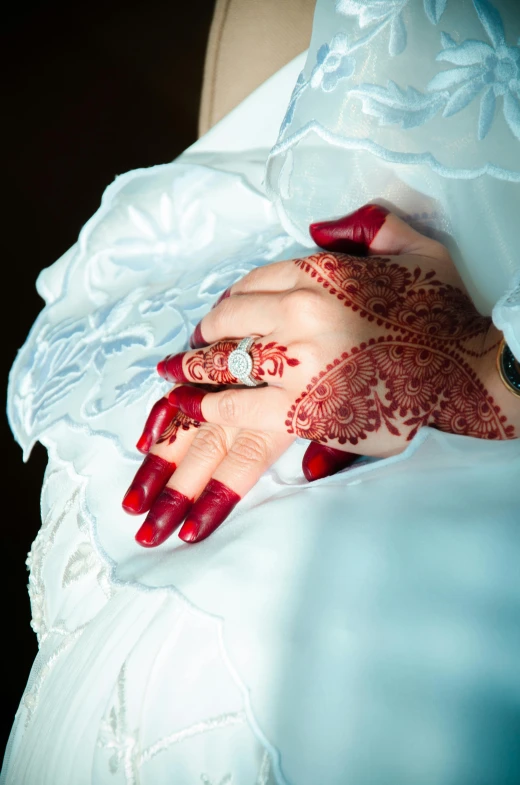 a henna is worn on the hand of a bride