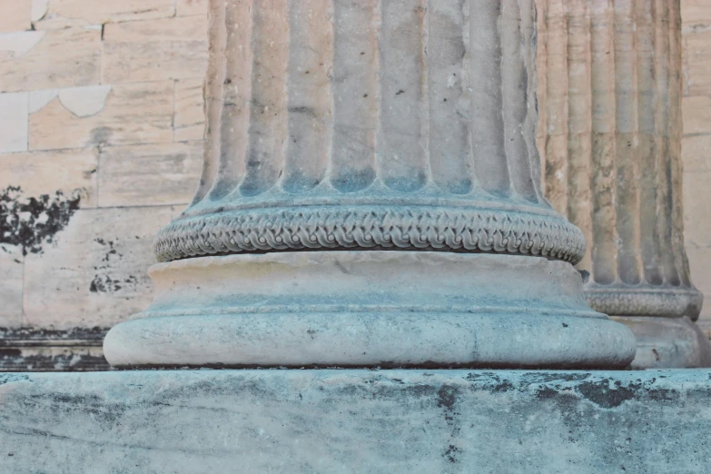 a stone column with columns that are outside