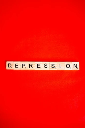 a red wall with the word depression in small letters