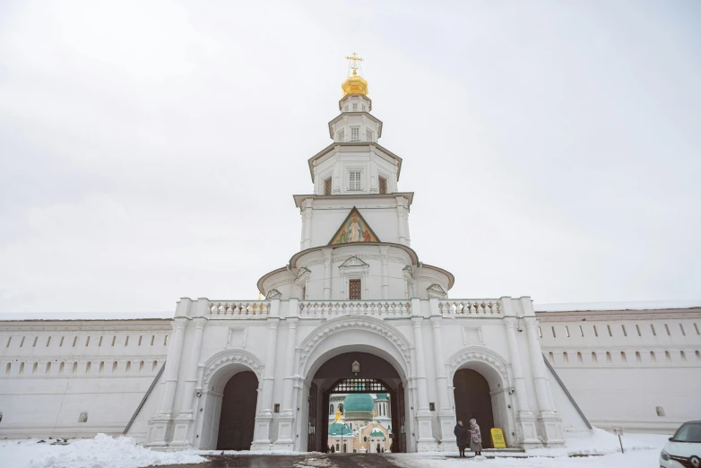 an entrance way to a church in the winter