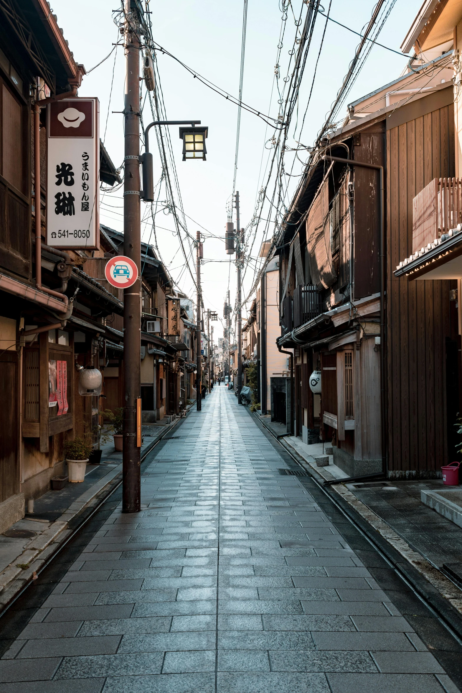 street lights and old buildings line the deserted streets