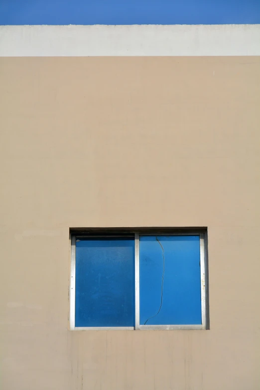 a closed window that looks out onto the street