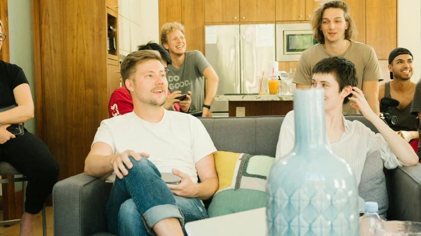 a group of people sitting in a living room