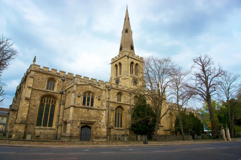 an old church with tower on the side