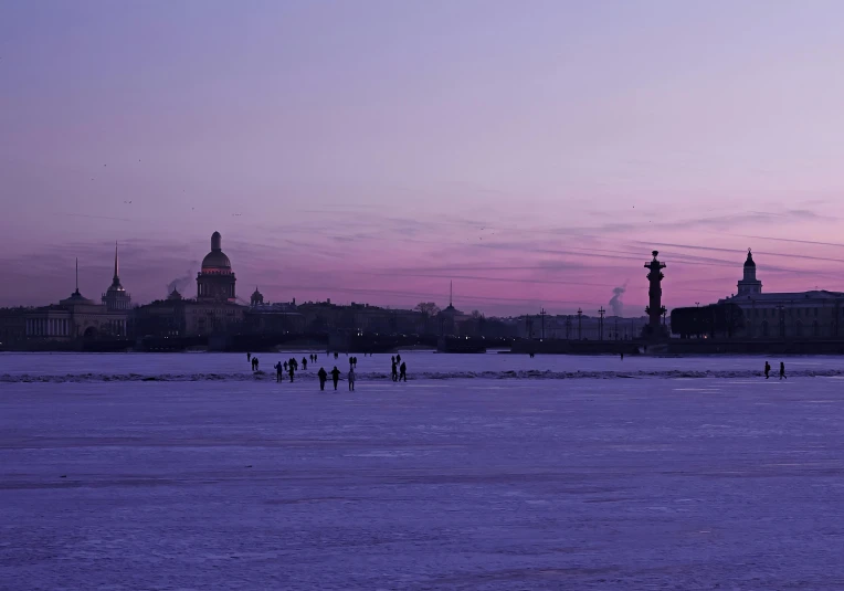 people walk on the frozen river during a dusk