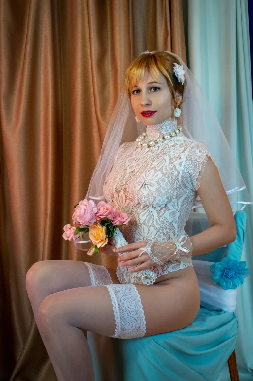 woman wearing garter and stockings holding wedding bouquet