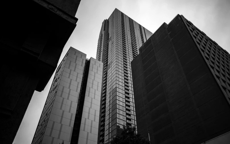 the architecture of some skyscrs in black and white