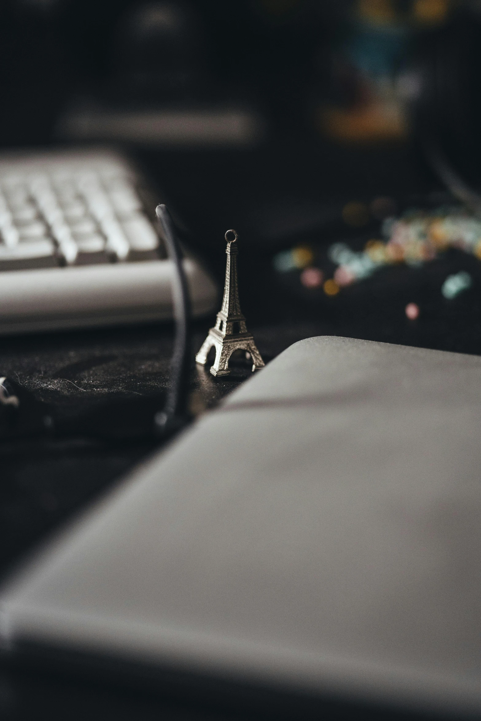 a cell phone and keyboard are on the table