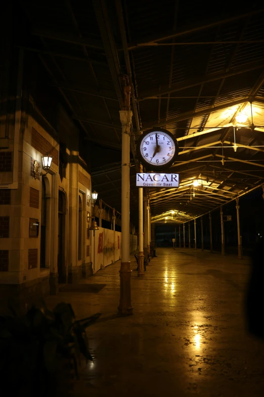 a po taken at night shows an empty, well lit train station