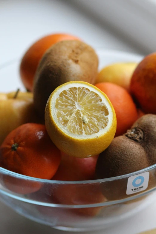 a bowl of fruit with an orange slice