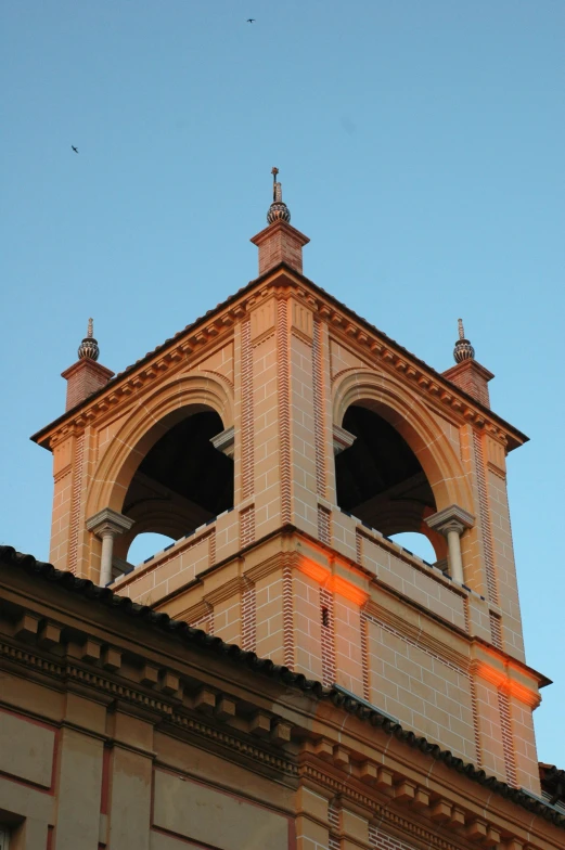 the light shining on a brick building below