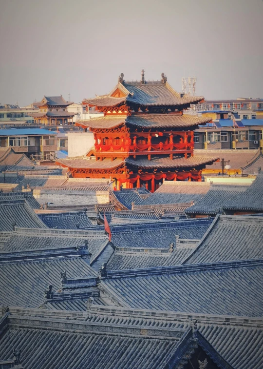 a tall building sitting on top of a roof