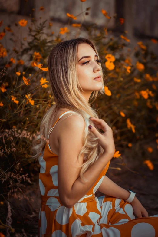 a girl is standing on some petals looking into the distance