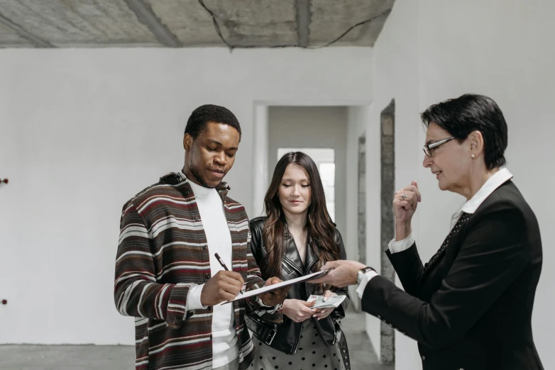 two people in a large room with a clipboard