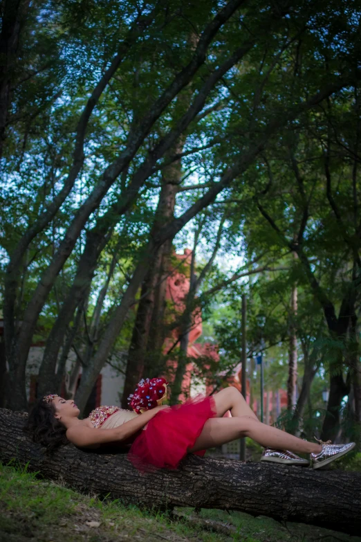 a person that is laying down on a log