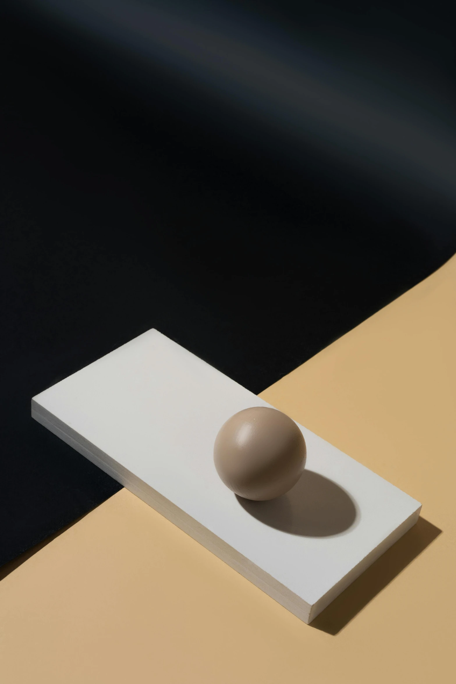 the object is placed on a white and yellow table