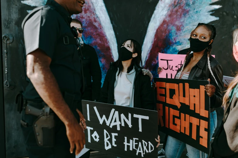 group of protesters holding signs against sexual rights