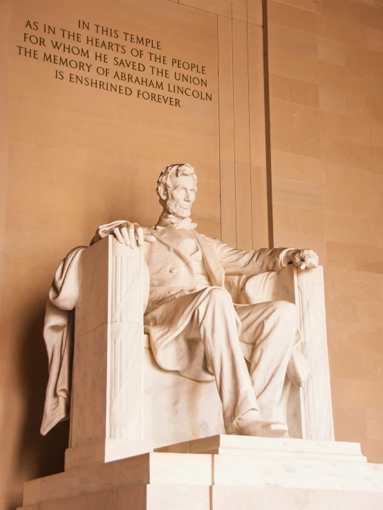 an old po of a stone statue of aham lincoln